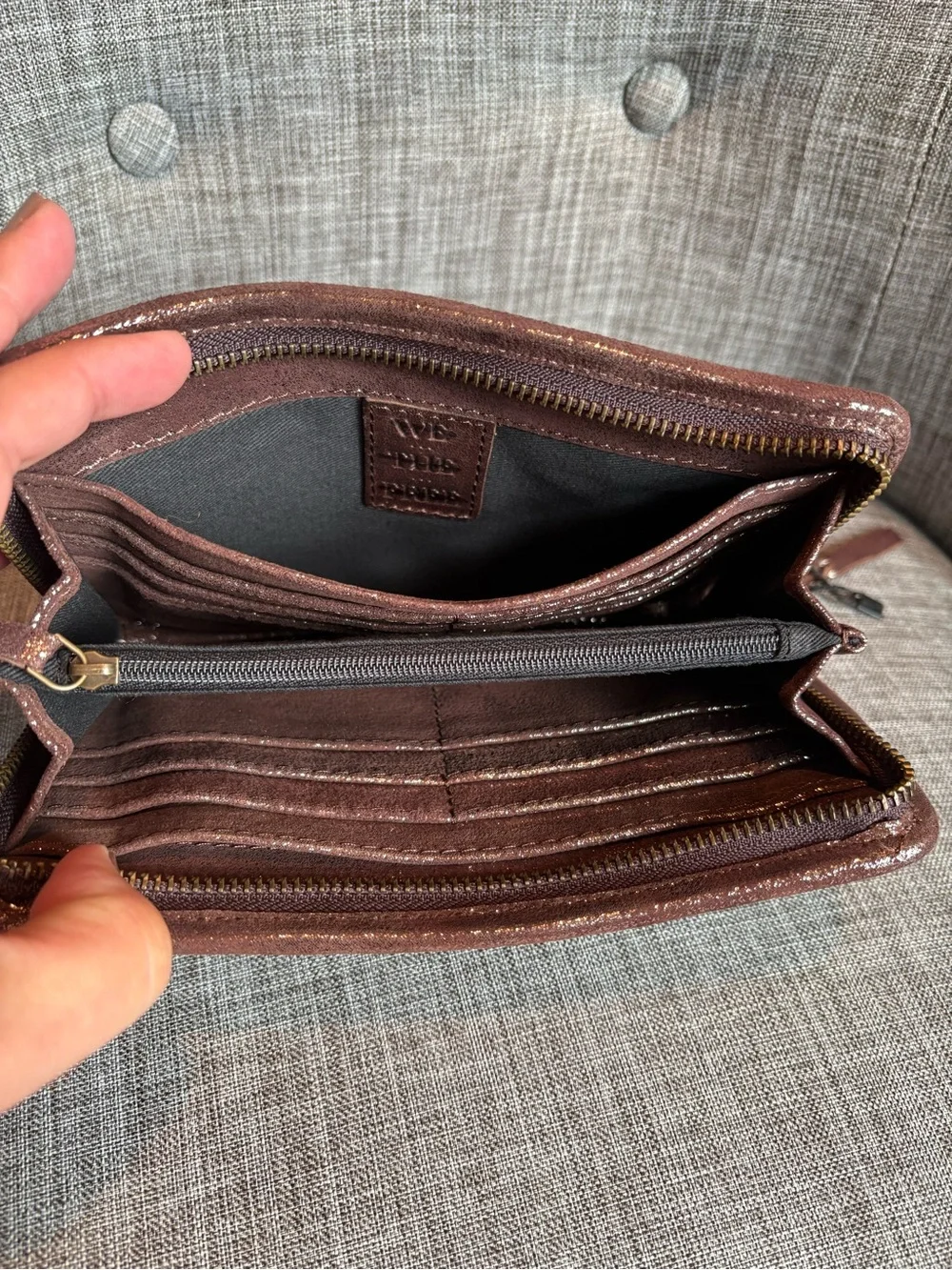 We The Free Brown / Gold Leather accordion zip wallet.